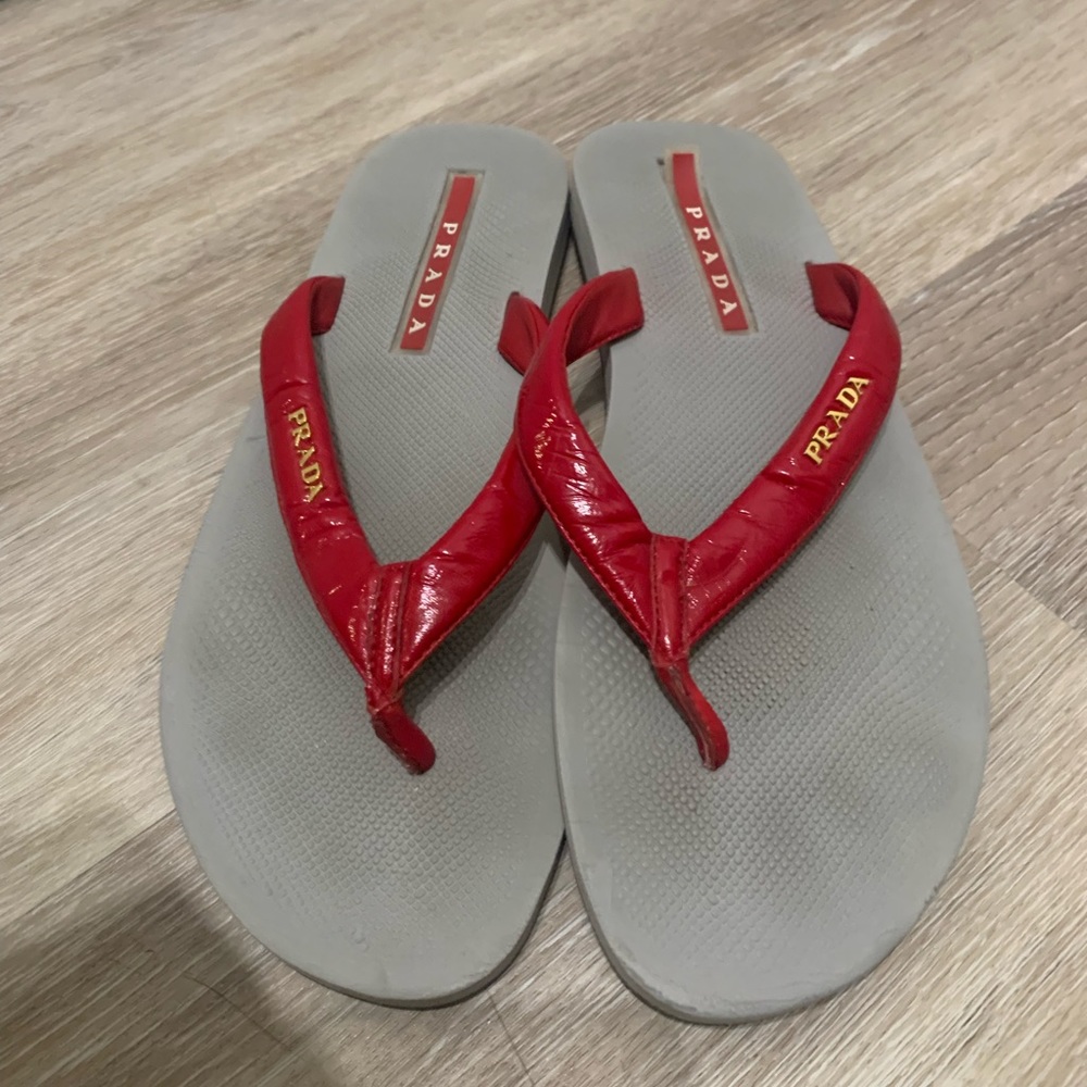 Red patent leather Prada flip flops